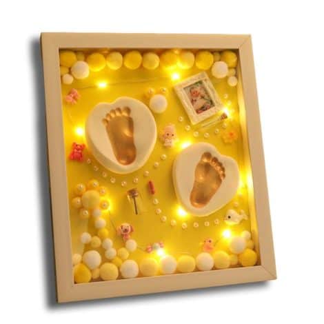 VISMIINTREND Wood Baby Clay Hand and Footprint Casting Kit with Frame, perfect gift for new parents in yellow.