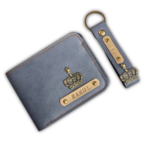 The Junket Personalized Wallet and Keychain Combo Set, specially customized with your name tag and charms. Available in grey.