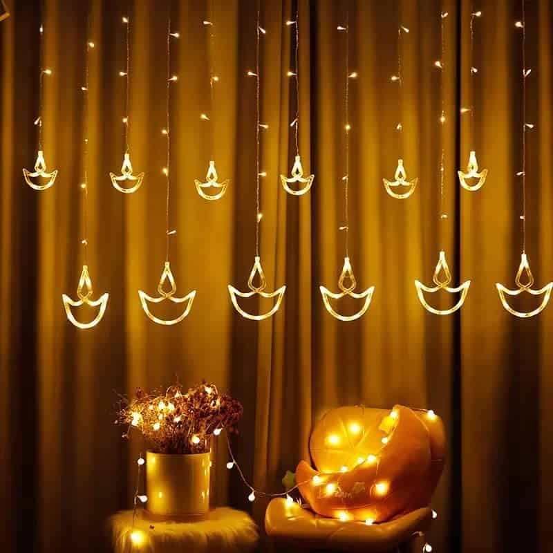 The Bright Storey ® 12 Diya Curtain String Lights, Window Curtain Lights with 8 Flashing Modes Decoration for Christmas, Wedding, Party, Home, Patio Lawn, Warm White (6+6 Diyas)