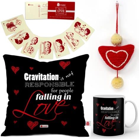 Valentine’s Day gift set with a black cushion cover, mug, love postcards, and a heart hanging. Perfect for your loved one!