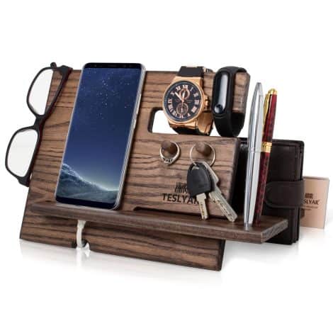 Wooden phone docking station with ash wood finish, key hooks, and multiple compartments for organizing essentials. Perfect gift for men.